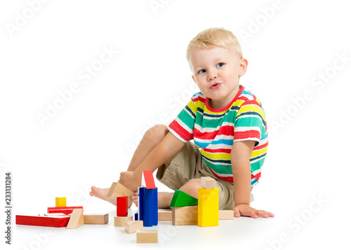 Little boy playing cubes si...