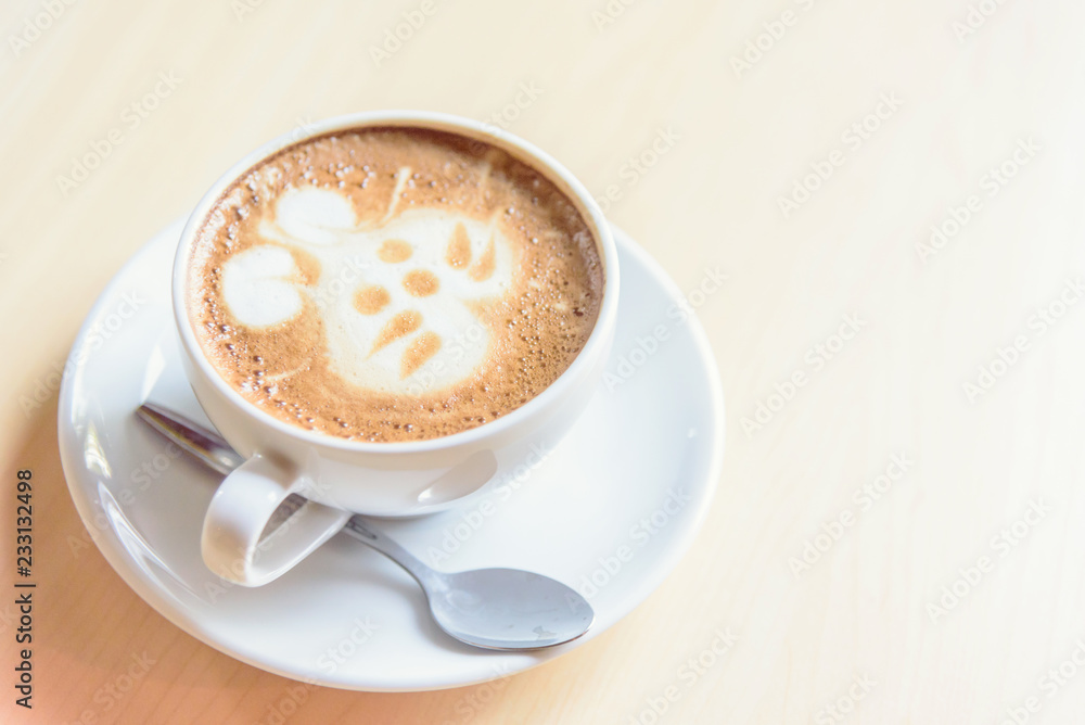 hot cappuccino coffee with cute cream rabbit pattern on table hot cappuccino coffee with cute cream rabbit pattern on table