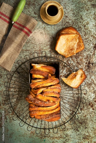 Overhead view of cinnamon sugar bread in loaf tin photo