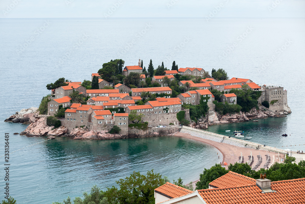 View from city at the Sveti Stefan islet and hotel resort. Adriatic sea, Montenegro, Europe