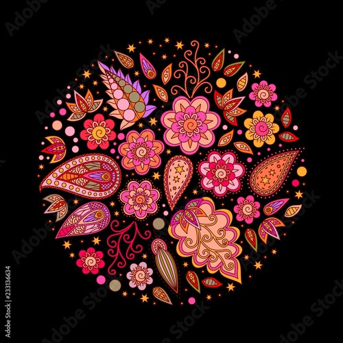 Round composition of flowers and leaves isolated on a black background.