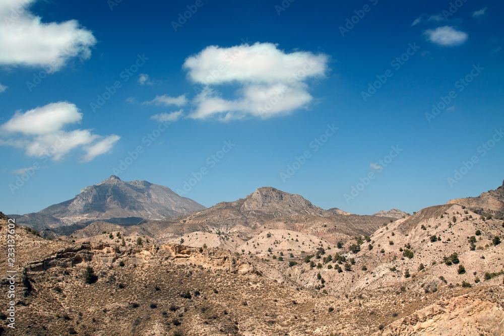  Semi-desert landscape with hills and sparingly vegetation in the vicinity of Muchamiel, Spain. 