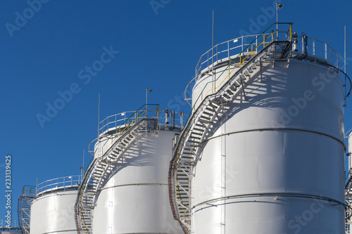 Fuel tanks at the tank farm. Big Industrial oil tanks in petroleum storage terminal