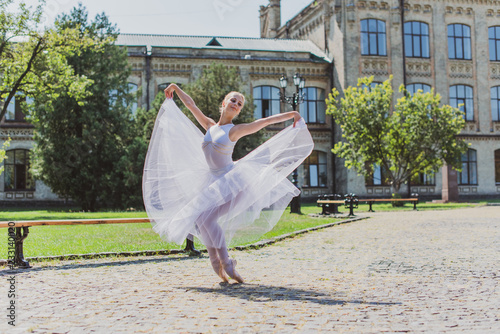 Ballet dancer at city streets, concept of elegant ballerina, inspired girl outdoor