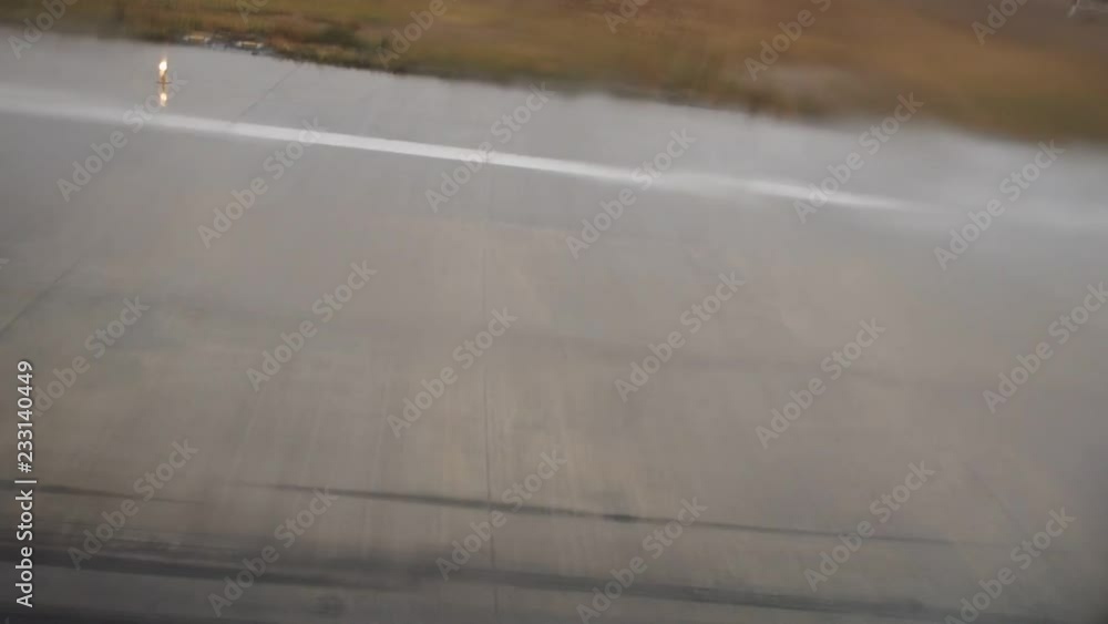 View from a jet gliding on Airport runway as seen from inside the aircraft. Fast motion. View from a jet gliding on Airport runway as seen from inside the aircraft. Fast motion.