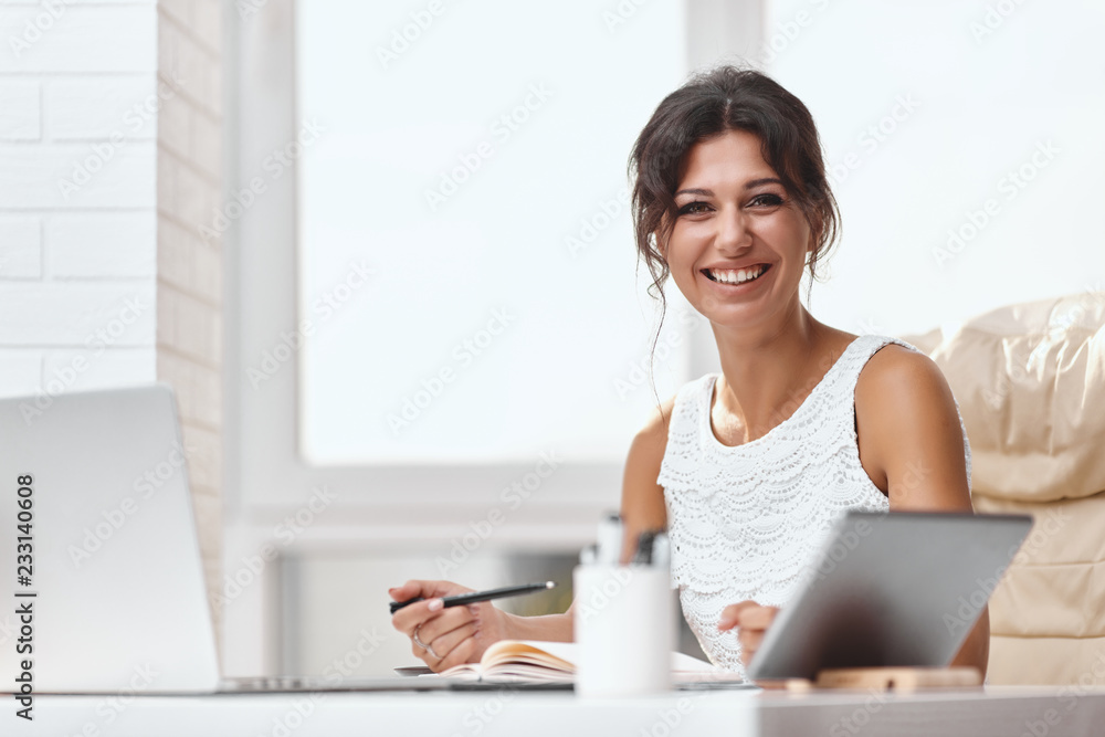 Young brunette business woman in a modern office Young brunette business woman in a modern office
