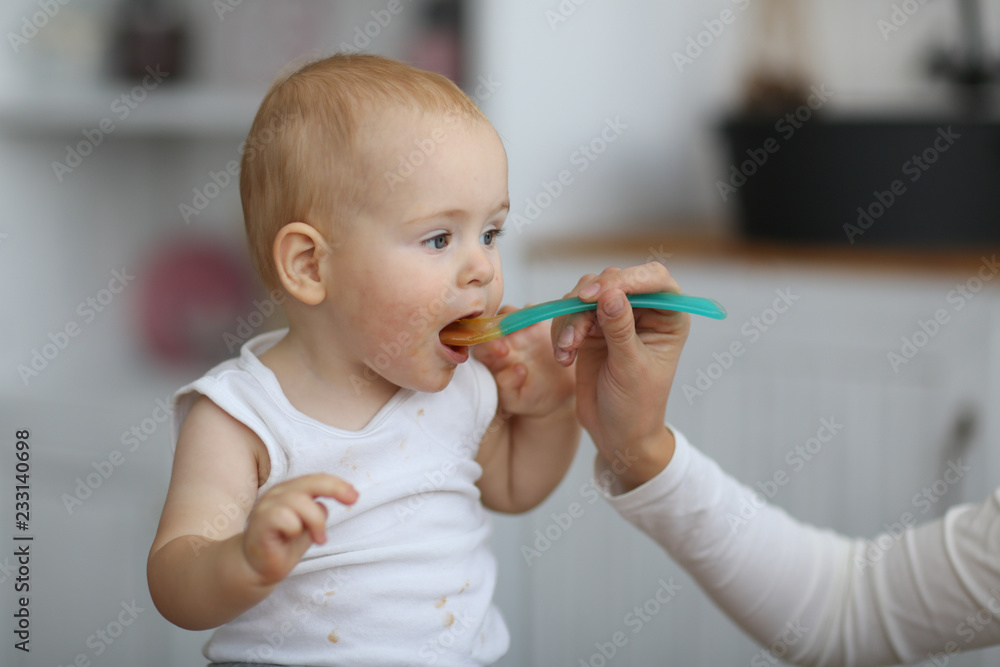 happy baby with an appetite stretching for spoon happy baby with an appetite stretching for spoon