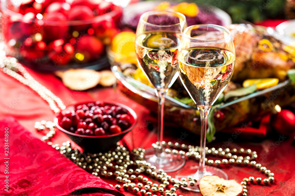 Christmas themed dinner table with champagne glass Christmas themed dinner table with champagne glass