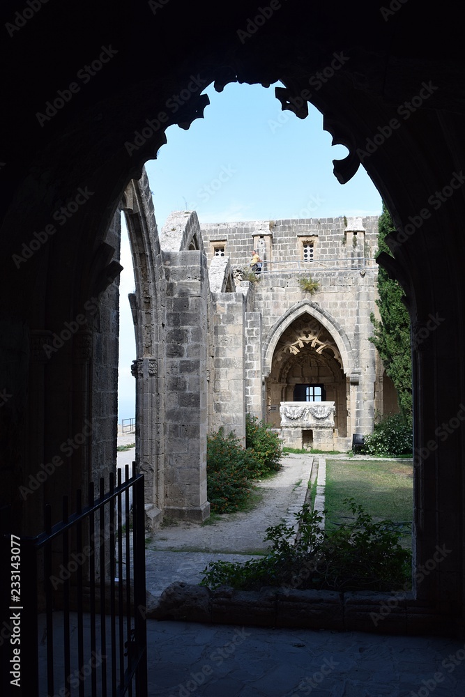 The pointed arch, the flamboyant Gothic style, stone ornaments..The interior is Gothic. Gothic Abbey. Medieval Abbey. Bellapais Abbey. Cyprus