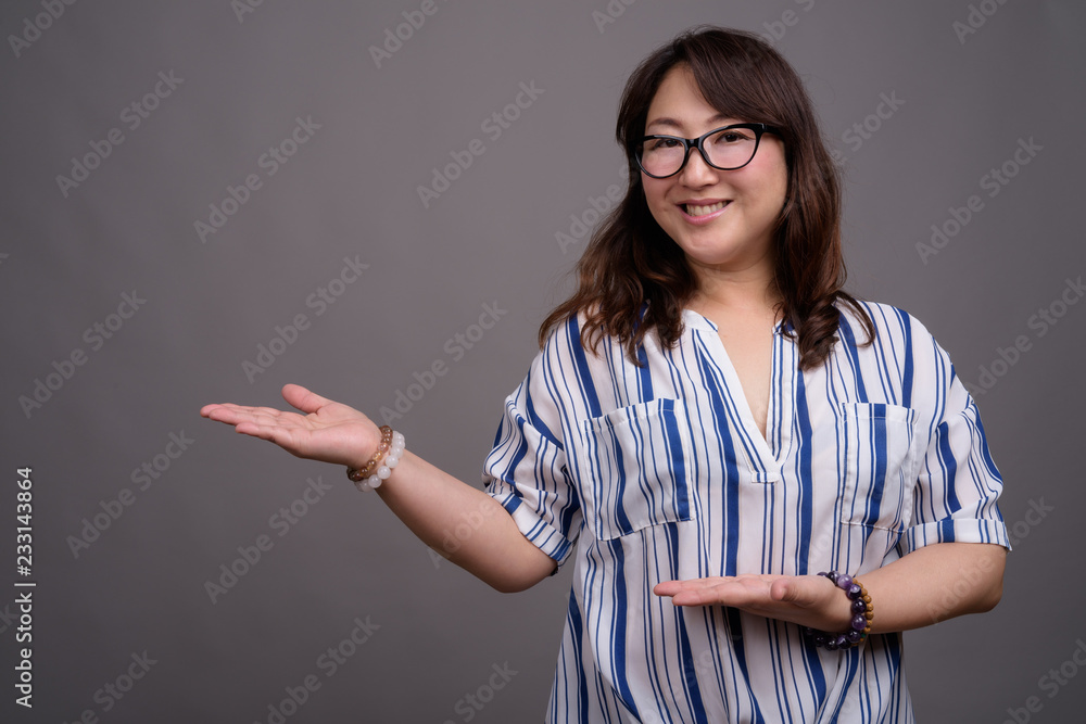 Portrait of mature Asian businesswoman wearing eyeglasses Portrait of mature Asian businesswoman wearing eyeglasses