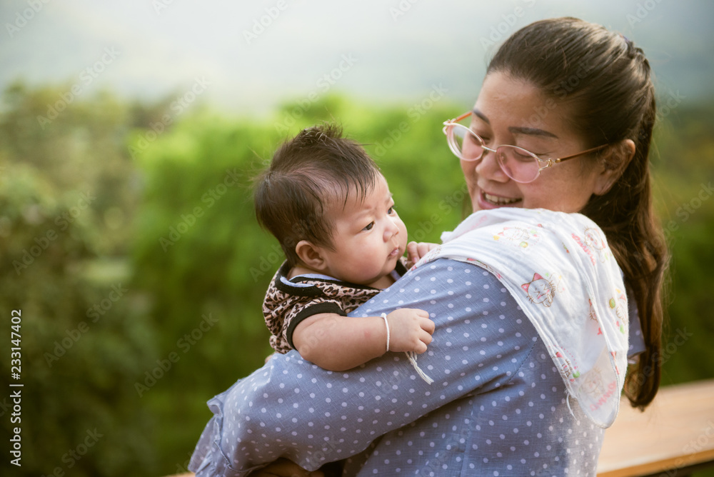 Portrait of happy loving mom with her baby in outdoors. Portrait of happy loving mom with her baby in outdoors.