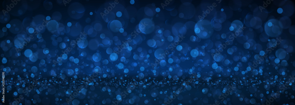 Blue abstract blurred banner with bokeh effect.