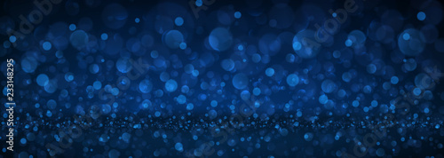 Blue abstract blurred banner with bokeh effect.