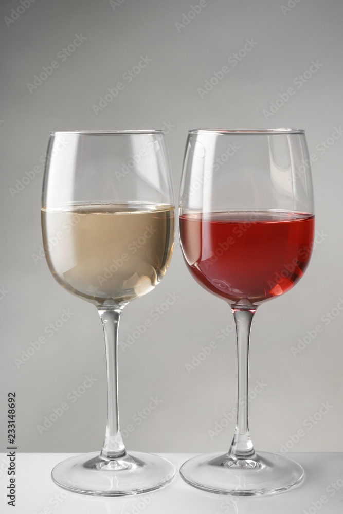 Glasses of expensive red and white wines on table Stock Photo Adobe Stock