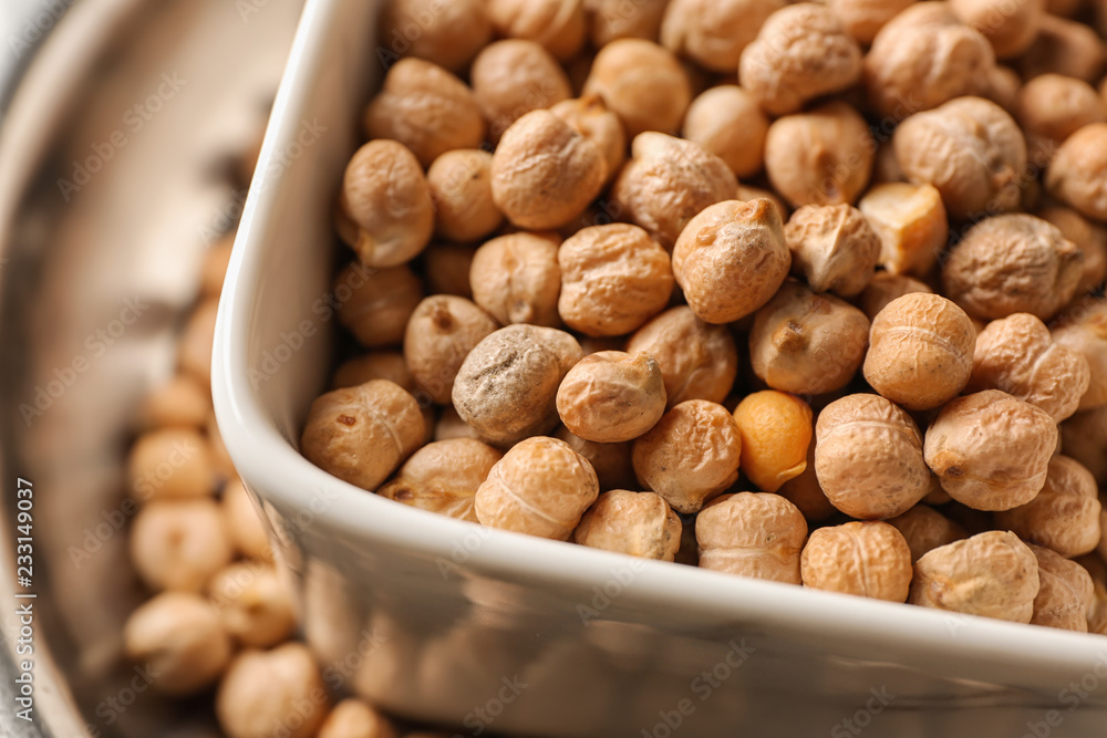 Bowl with dry chickpeas, closeup Bowl with dry chickpeas, closeup