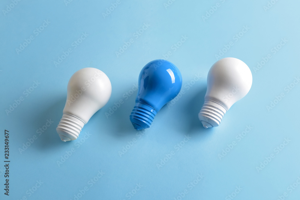 Painted light bulbs on color background Painted light bulbs on color background