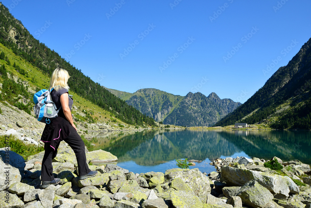 Female hiker in the mountains. Gaube lake, Hautes Pyrenees, France.