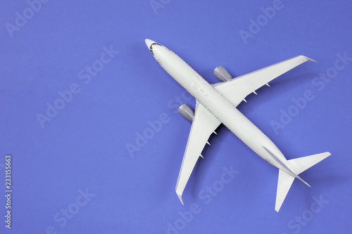 Photo of airplane isolated on empty blue background