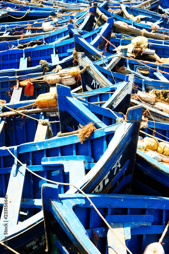 Fishing blue boats in Marocco. Lots of blue fishing boats in the port of Essaouira, Morocco Fishing blue boats in Marocco. Lots of blue fishing boats in the port of Essaouira, Morocco