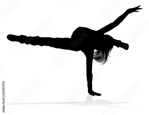 A woman street dance hip hop dancer in silhouette