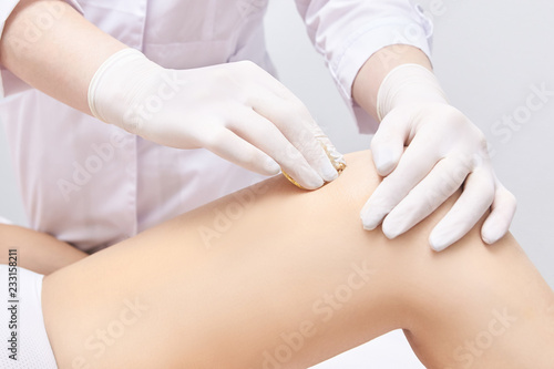 Depilation spa procedure. Woman hair remove waxing. Epilation sugaring. Legs foot