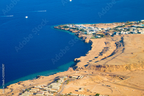 Egypt with flight height, hotel building and red sea