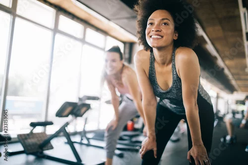 Obraz Fit sportswoman exercising and training at fitness club