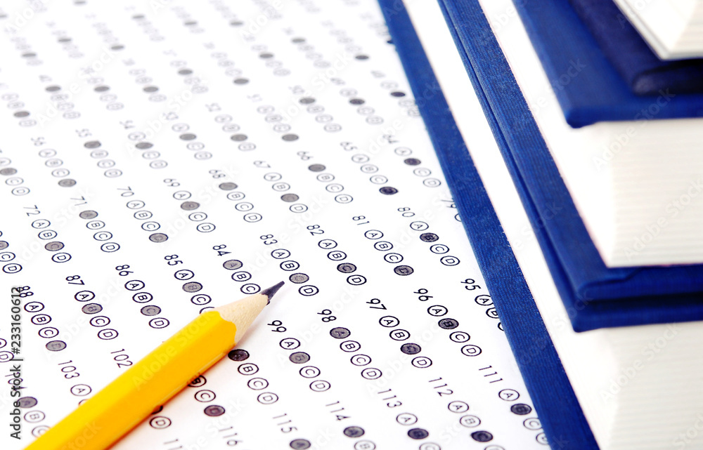 Filled answer sheet with eraser focus on pencil Filled answer sheet with eraser focus on pencil