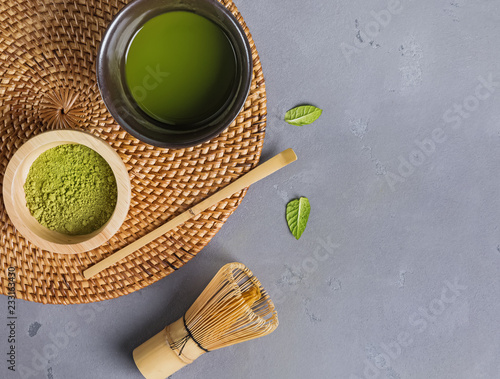 Traditional atcha tea making accessories on the grey color background photo