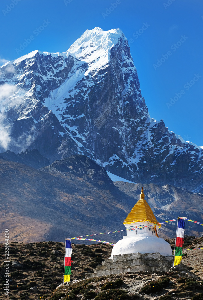 Tibetan buddha Stupa and trekker with Mount Everest background near Namche bazaar Nepal