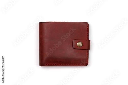 closed red leather wallet on a white background