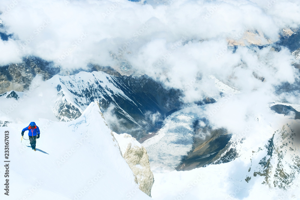 Group of climbers reaches the summit of mountain peak. Success, freedom and happiness, achievement in mountains. Climbing sport concept. Group of climbers reaches the summit of mountain peak. Success, freedom and happiness, achievement in mountains. Climbing sport concept.