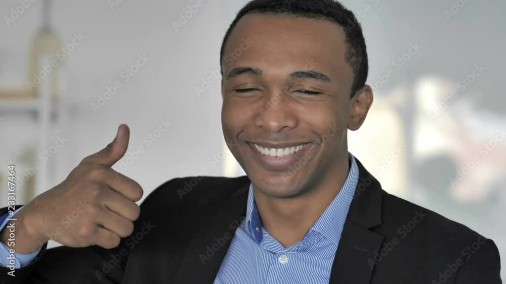 Thumbs Up by Casual Afro-American Businessman Looking at Camera Thumbs Up by Casual Afro-American Businessman Looking at Camera