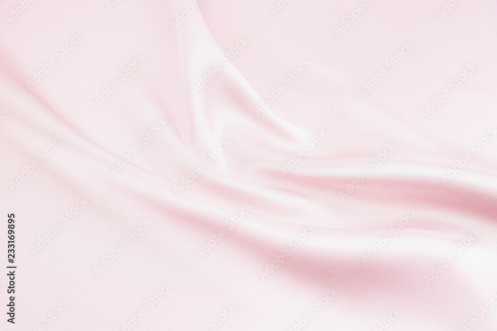 The texture of the satin fabric of pink color for the background The texture of the satin fabric of pink color for the background