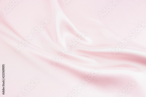 The texture of the satin fabric of pink color for the background  photo