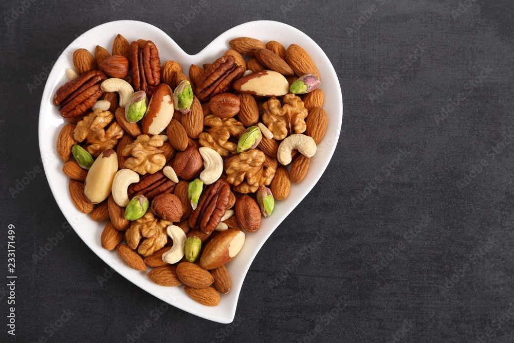 Nuts on a plate in the shape of a heart. Nuts on a plate in the shape of a heart.