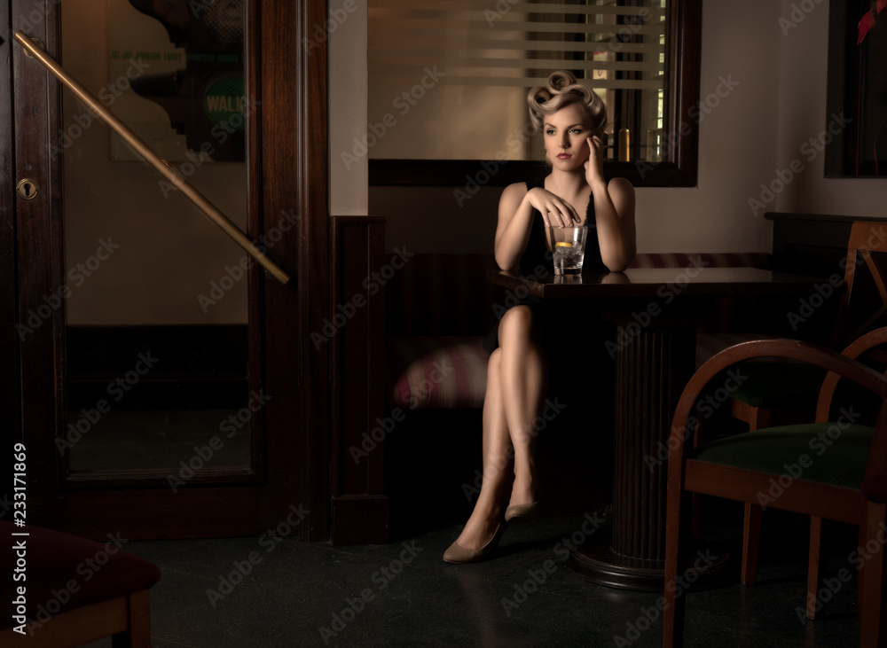 Movie scene with a femme fatal waiting in a restaurant. Movie scene with a femme fatal waiting in a restaurant.