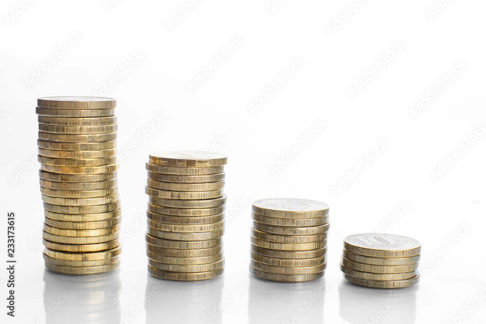 coin stacks chart on white surface with reflection coin stacks chart on white surface with reflection