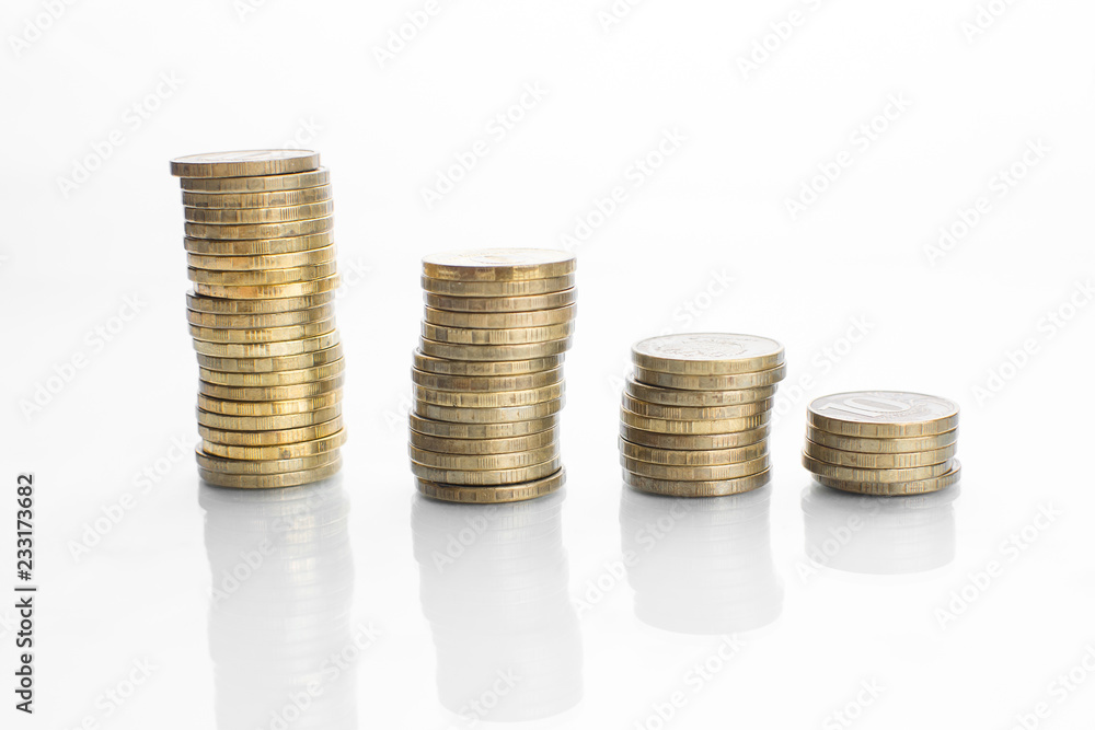 coin stacks chart on white surface with reflection coin stacks chart on white surface with reflection