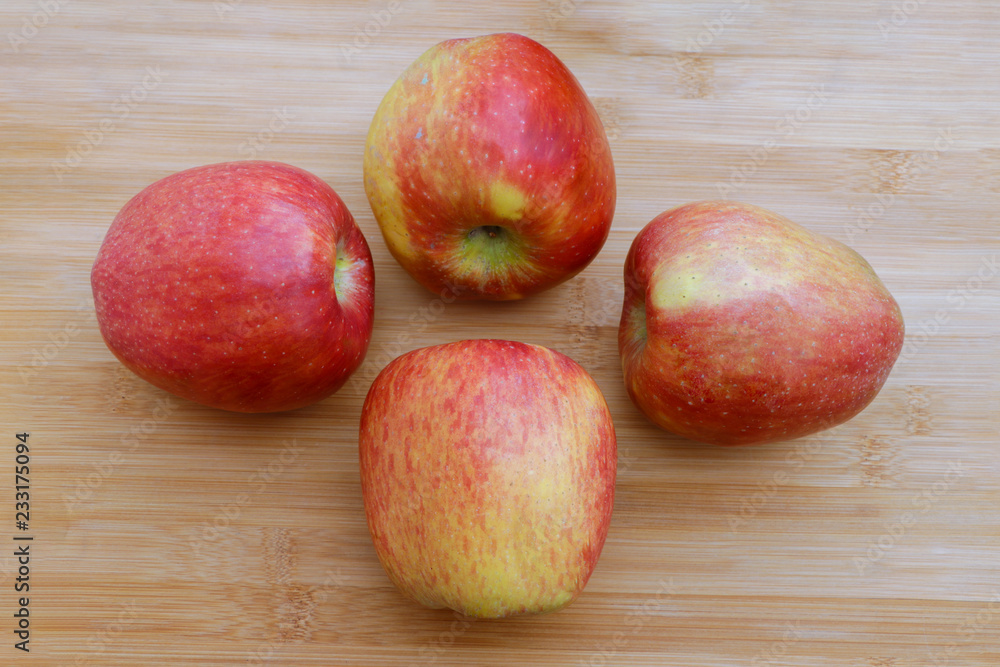 Group of red apples on wooden surface Group of red apples on wooden surface