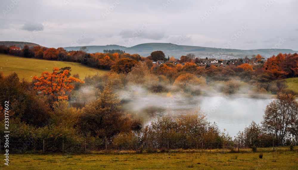 Mist rising from a lake at Autumn Fall time in South Wales UK
