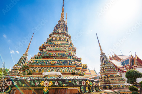 Beautiful Buddhist temple Wat Pho in the capital of Thailand Bangkok against the blue sky, bright colors, sights, a trip to Asia, the culture and architecture of Southeast Asia