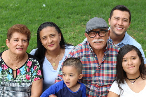 Happy family of six Latinos 