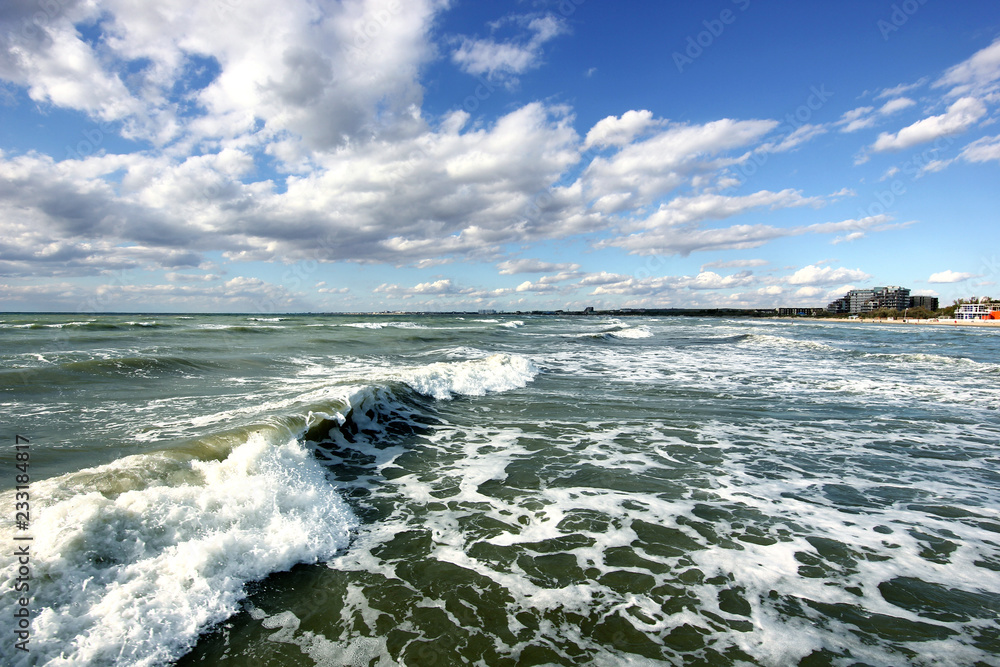 seascape with frothy waves and a beautiful sky