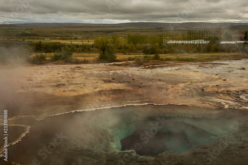 Icelandic landscape.Hot geyser spouting out of the ground 
