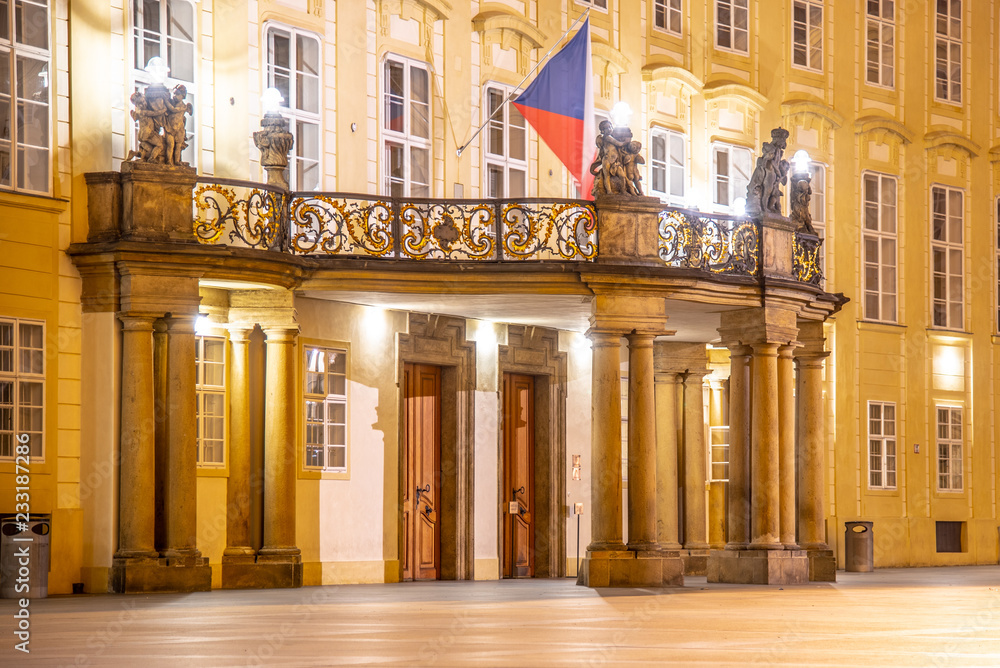 Entrance door with balcony to the Archives of Prague Castle on Third Courtyard by night, Prague, Czech Republic.