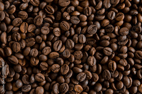 Roasted coffee beans as backgroundon the table