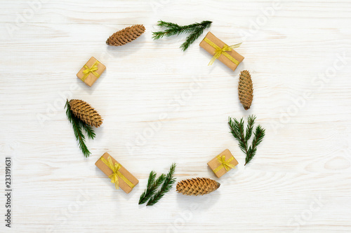 Christmas composition. Round frame of fir branches and cones on white background. Flat lay, top view, copy space,