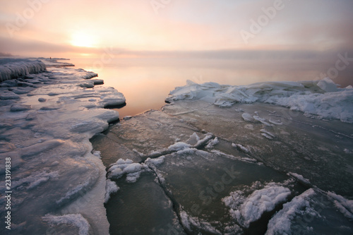 Peaceful sunset over the frozen seaside