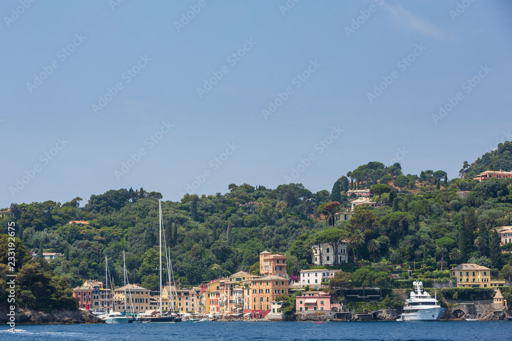 Buildings on the cliffs overlooking the beautiful harbour at Portofino on the  Ligurian coast, Italy